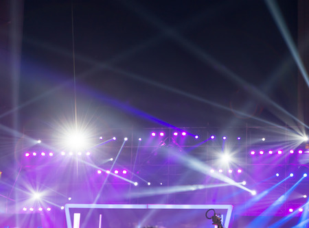 multiple spotlights on a theatre stage lighting rig