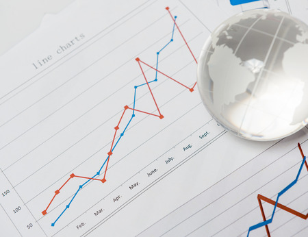 Business presentation with globe and chart on the desk
