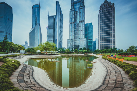 city park with modern building background in shanghai