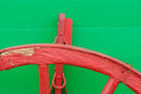 Close up of a green wagon with red wheelsの写真素材
