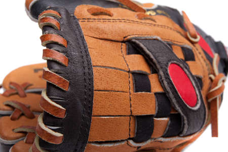 A baseball glove and ball on a white backgroundの写真素材