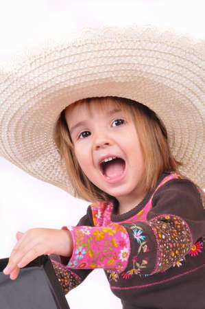 Beautiful little girl with laptop on the white backgroundsの写真素材