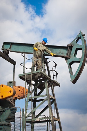 worker in the oil industry on oil pumpの写真素材