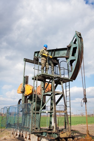 worker in the oil industry on oil pumpの写真素材