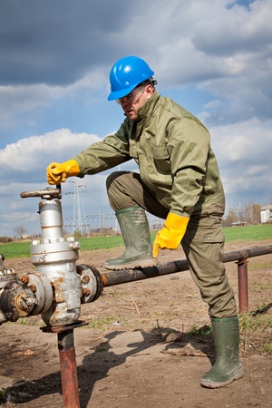 worker in the oil industry on oil pumpの写真素材