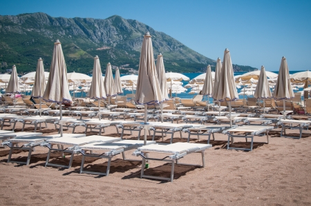 beautiful beach  with beach beds and umbrellaの写真素材
