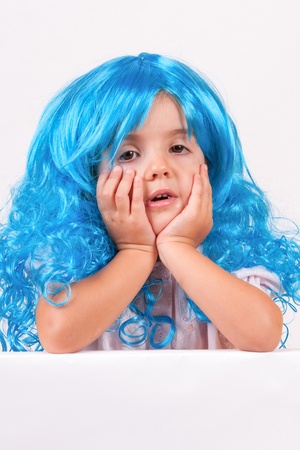 Little girl with blue wigの写真素材