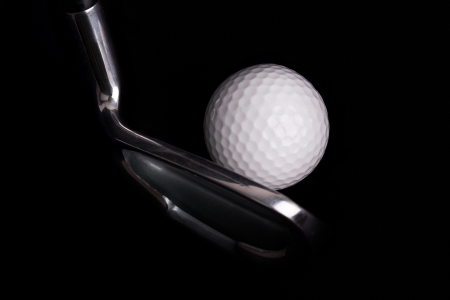 golf club with ball on black background の写真素材
