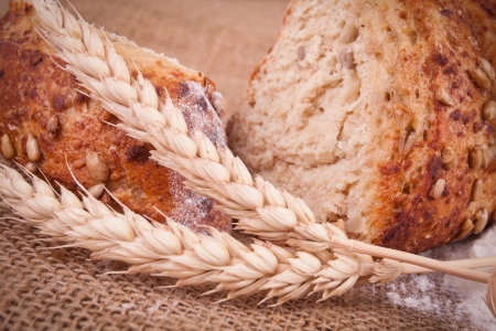 assortment of baked bread on wood tableの写真素材
