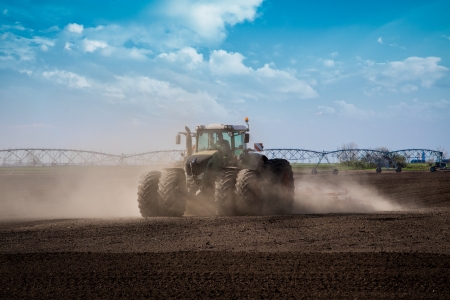 Tractor in the field sowの写真素材