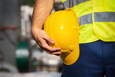 man holding yelow helmetの写真素材