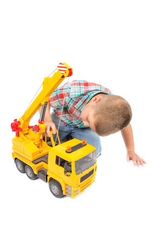 little boy plays with toy truckの写真素材