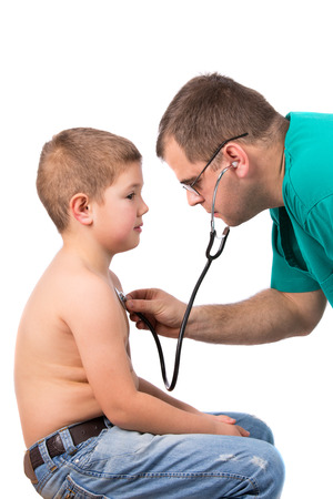 Doctor examining little boy in hospitalの写真素材