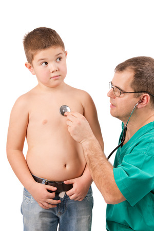 Doctor examining little boy in hospitalの写真素材