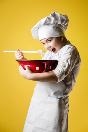 Little boy chef in uniformの写真素材