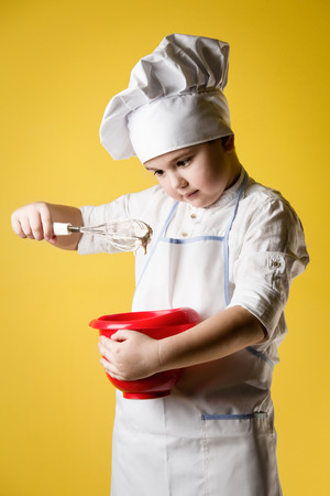 Little boy chef in uniformの写真素材
