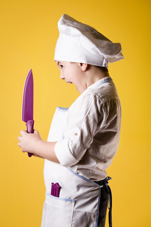 Little boy chef in uniformの写真素材