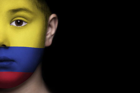 Human face painted with flag of Colombiaの写真素材