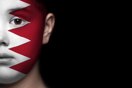 Human face painted with flag of Bahrainの写真素材