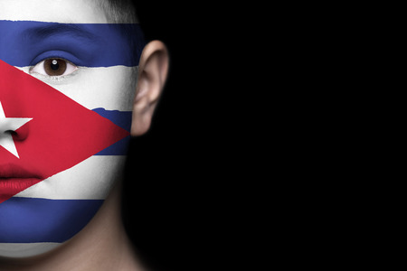 Human face painted with flag of Cubaの写真素材
