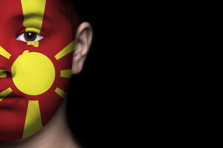 Human face painted with flag of Macedoniaの写真素材