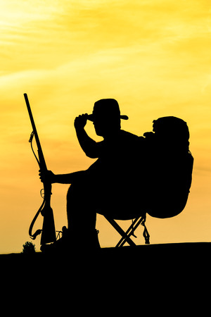Hunter With Shotgun in Sunsetの写真素材