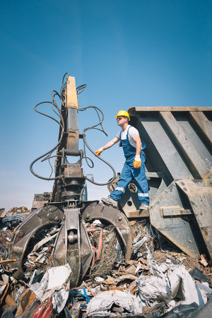 Worker in a junkyardの写真素材