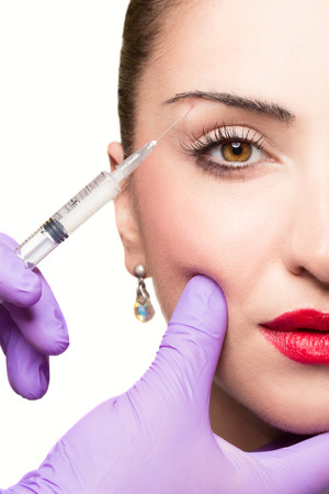 Woman gets cosmetic injection. Beauty Treatmentの写真素材