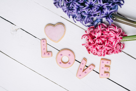 Beautiful spring flowers on wooden backgroundの写真素材