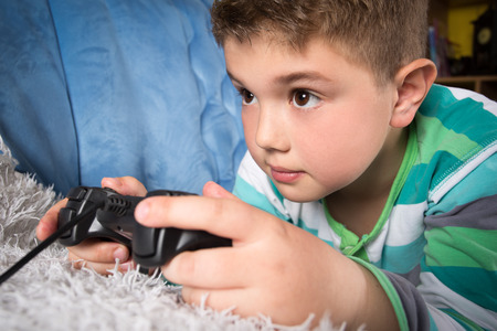 Little boy playing video games