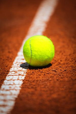 Tennis ball on courtの写真素材