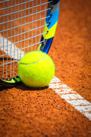 Tennis Ball and Racquet on the courtの写真素材