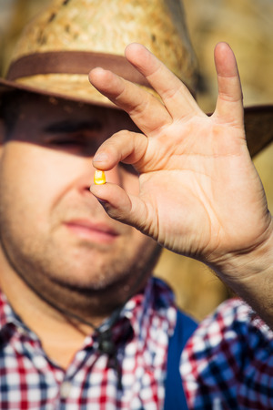Farmer holding corn seedの写真素材