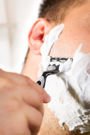 Man shaves his faceの写真素材