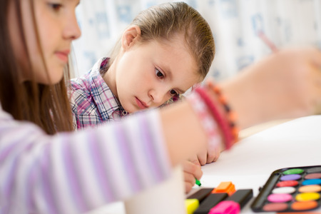 Little girls drawing pictures