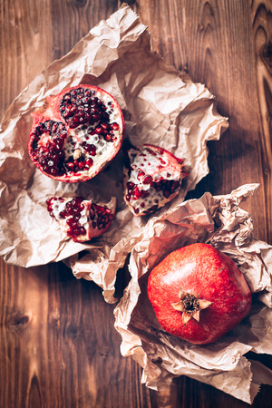 Pomegranates on a wooden backgroundの写真素材