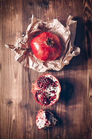 Pomegranates on a wooden backgroundの写真素材