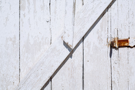 Wooden texture of wooden door and small metallic lock