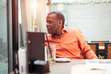 African American man sitting in a cafeの写真素材