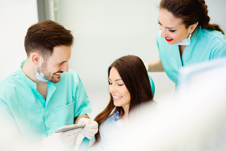 Assistant dentist and the patient in the clinicの写真素材