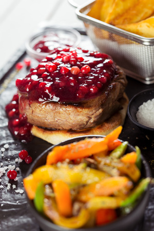 Grilled sliced beef steak on stone tableの写真素材