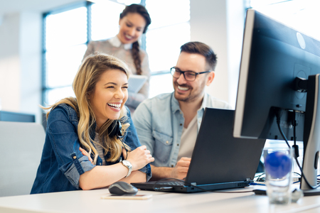 Group of business people and software developers working as a team in officeの写真素材