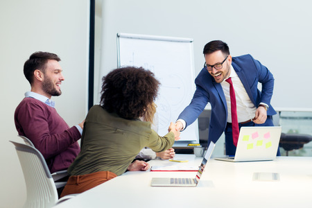 Business people shaking hands, finishing up a meeting