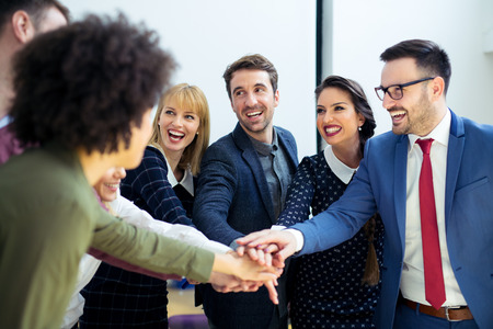 Business team joining hands togetherの写真素材