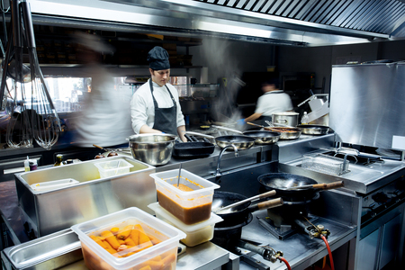 Motion chefs of a restaurant kitchen