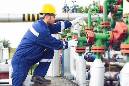 Operator recording operation of oil and gas process at oil and rig plant