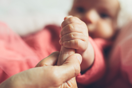 Mother holding her child's hand.の写真素材