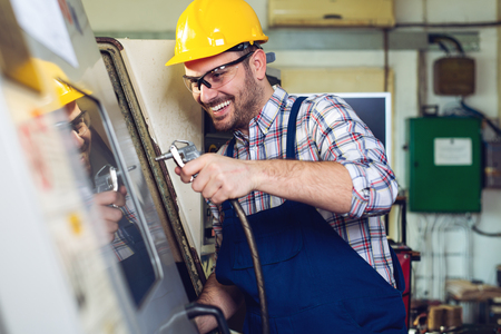 Worker Change CNC Machine Headの写真素材