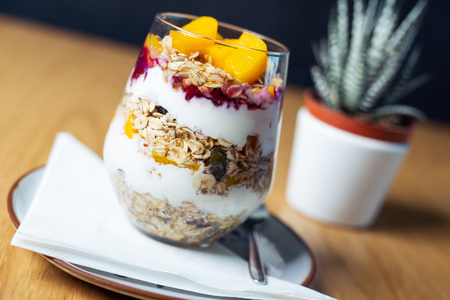 Healthy meal made of granola, yogurt and fruits. Delicious food for breakfast.の写真素材