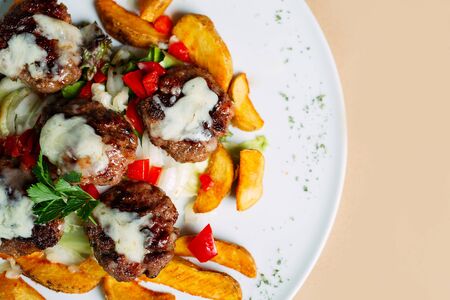 Meat balls with sauce and potatoesの写真素材